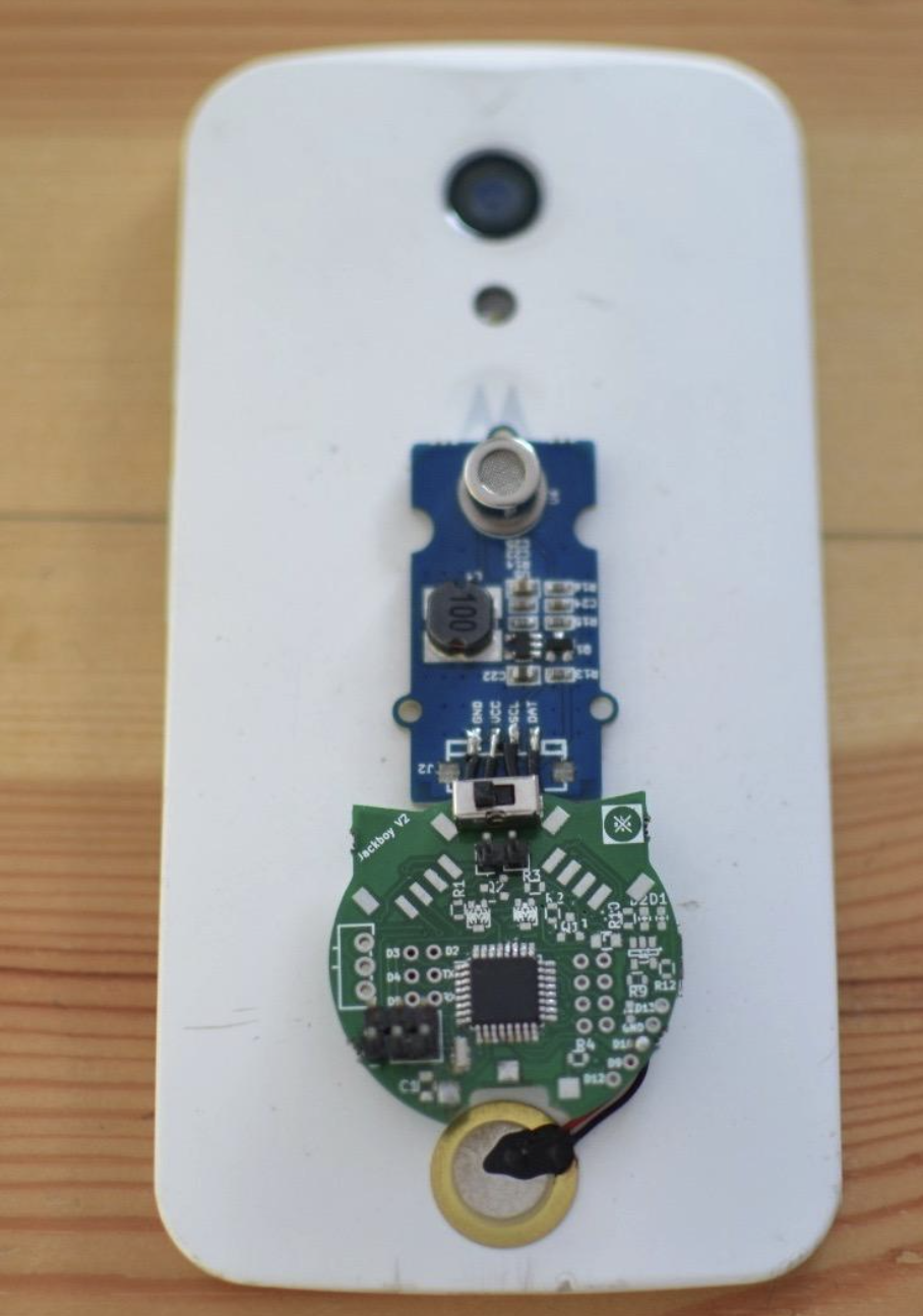 Jackboy PCB module close-up on smartphone